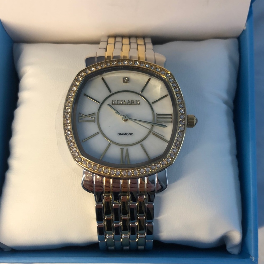 Brand new, never worn, Kessaris woman’s silver and gold watch with crystal bezel